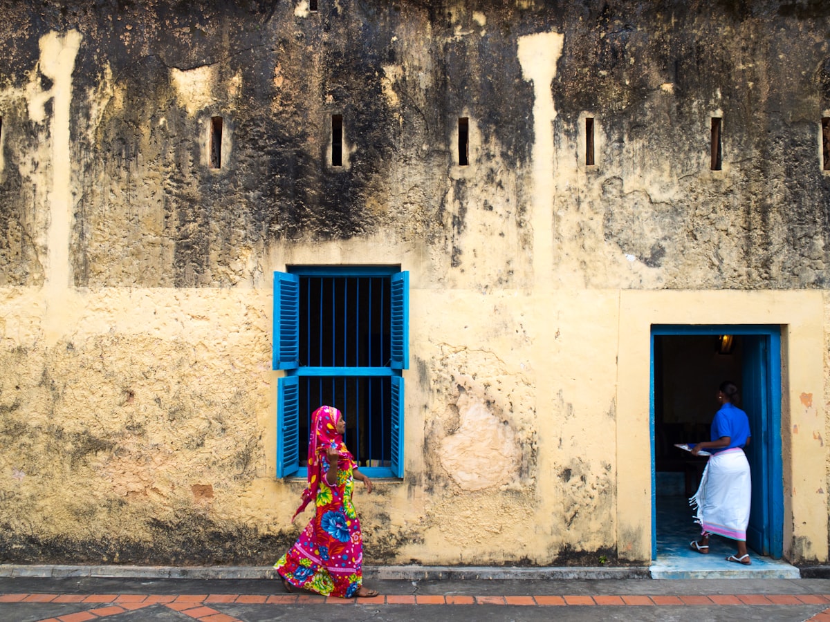 Travelers exploring the historic streets of Stone Town, Zanzibar